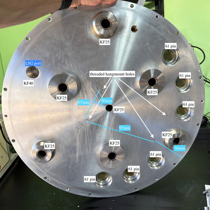 Bottom of an aerospace thermal vacuum chamber lid with multiple KF25 ports, 61 pin connectors, and a KF40 port